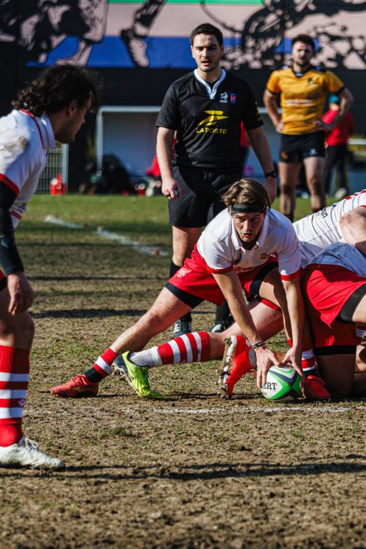 CS Clichy scrum-half picking up the ball from a ruck, 2025