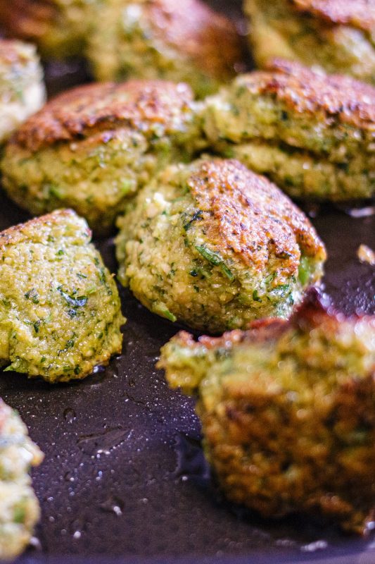 Homemade falafel frying in a pan, golden and crispy close-up