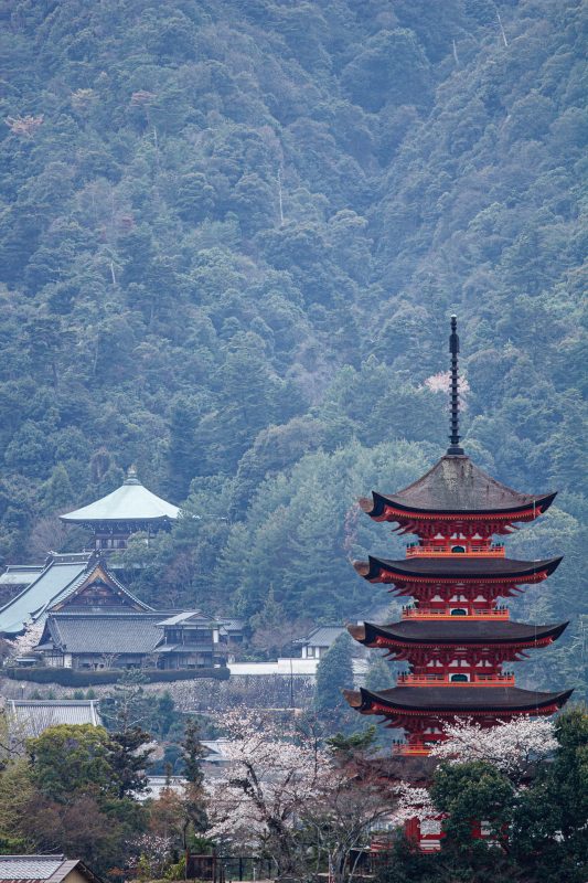 Five-story pagoda of Toyokuni Shrine and temple buildings against Mount Misen on Miyajima Island